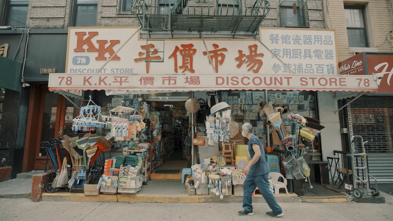 A person walks in front of a shop in China town